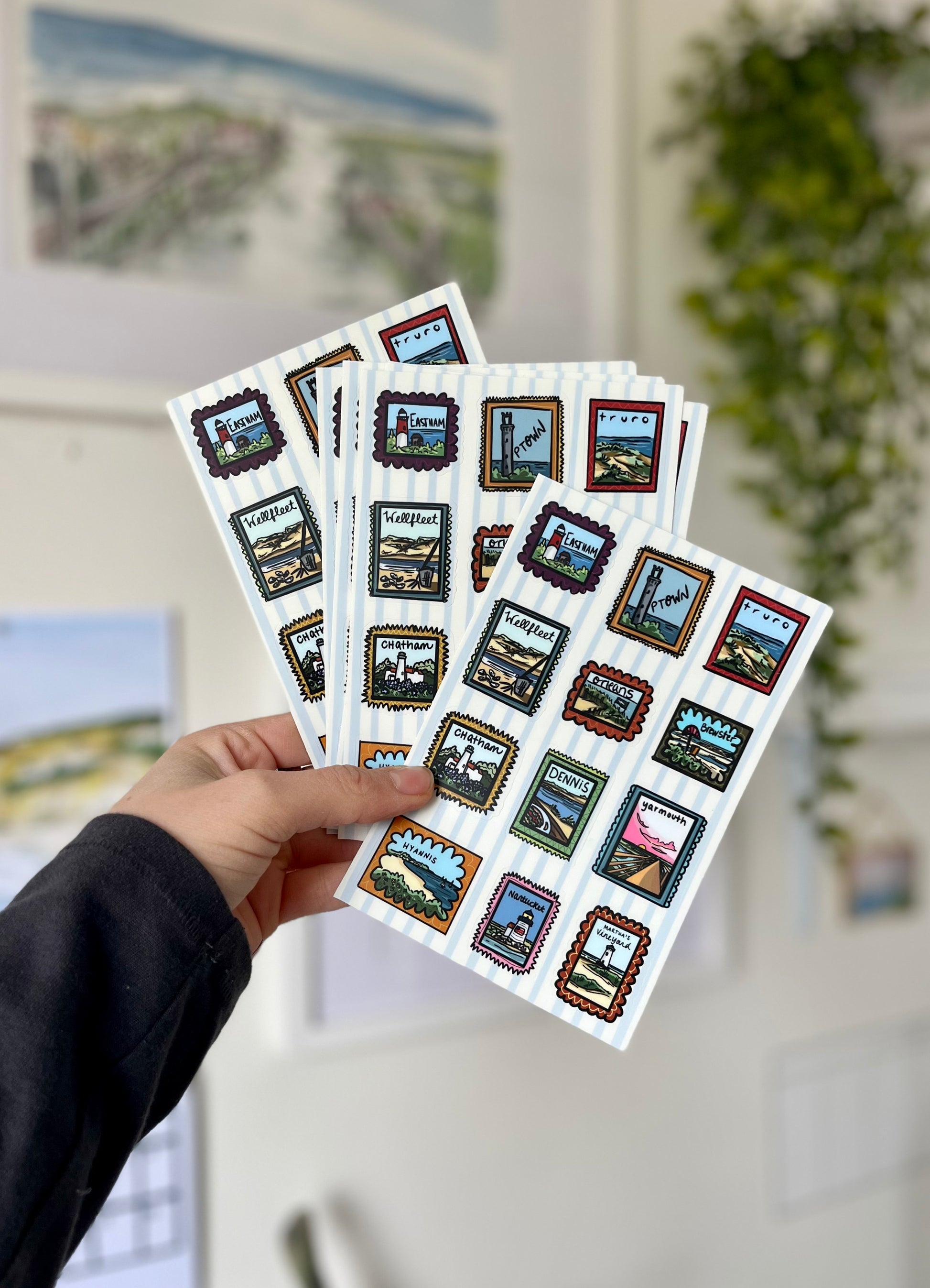 Cape Cod town-themed sticker sheet with hand-drawn stamp-style illustrations of Nauset Light, Wellfleet oysters, and Nantucket