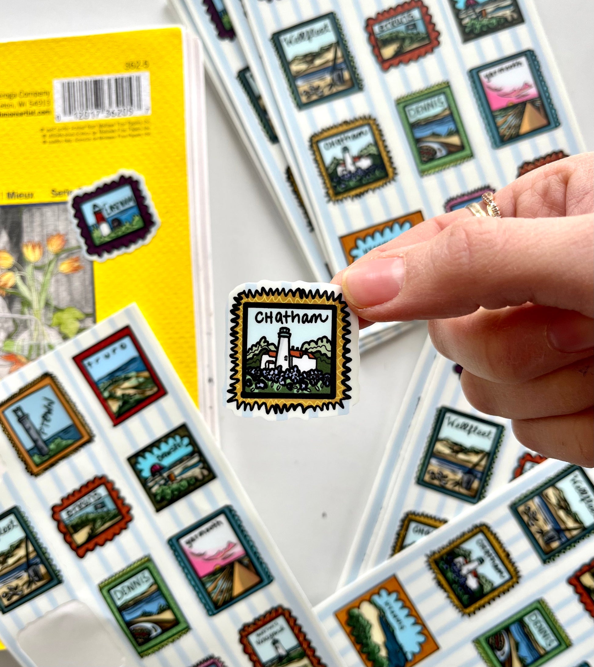 Cape Cod town-themed sticker sheet with hand-drawn stamp-style illustrations of Nauset Light, Wellfleet oysters, and Nantucket