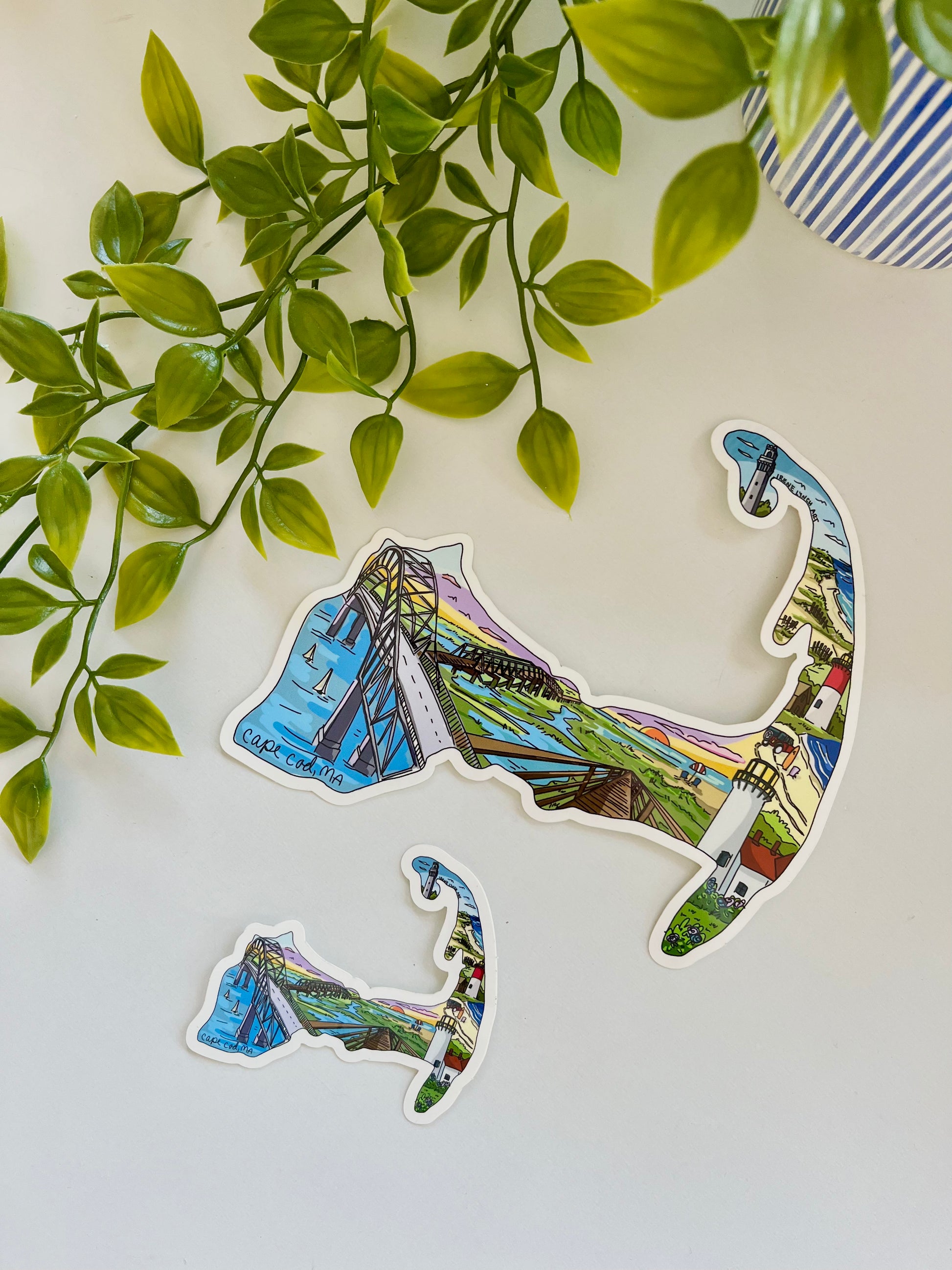 Cape Cod Map Sticker featuring Provincetown's Pilgrim Monument, Nauset Light, Chatham Lighthouse, Sandwich Boardwalk – illustrated waterproof vinyl sticker by Irene Lynch